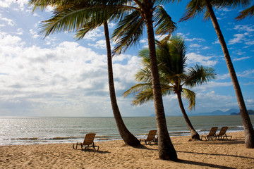 Deck chairs on a tropical beach in Far North Queensland, Australia.