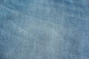 Faded blue jeans texture background