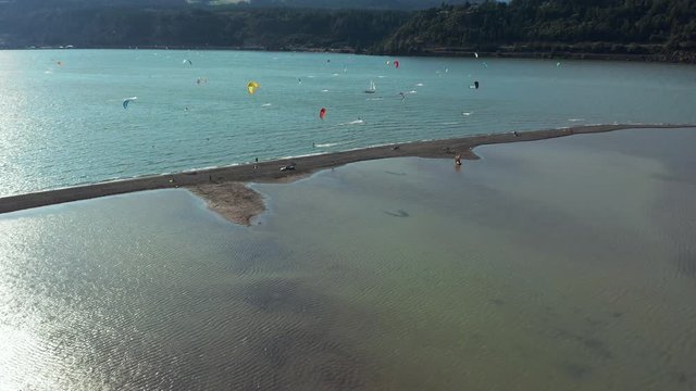 KITEBOARDING IS THE closest most of us humans will ever get to flying, and the Columbia River Gorge, a chasm lined with luscious evergreen forests, waterfalls, and cliffs on the Washington-Oregon bord