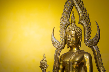 Buddha statue with yellow background