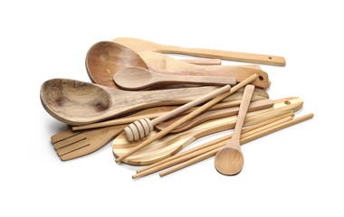 Wooden spoons, honey dipper and metal knife, kitchenware isolated on white background