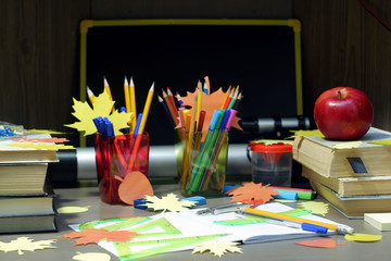 Back to school concept with empty checkered exercise book for homework, pen, pensil, compass,...