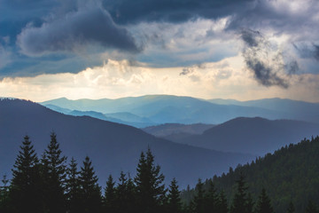 Dark storm clouds hang over the mountains. Bad weather in mountainous areas_