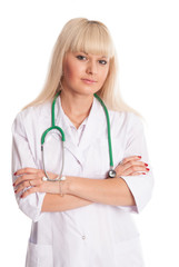 Fototapeta premium Nurse in a white coat with a stethoscope arms crossed.