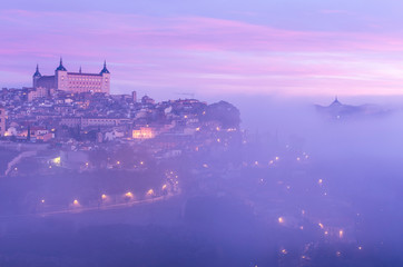Views of the beautiful city of Toledo (Spain) bathed in fog - obrazy, fototapety, plakaty