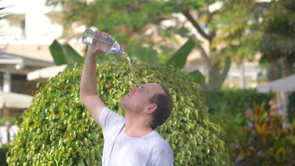 Pouring water on head on a hot day in slow motion 180fps