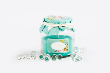 decorative glass jar of a candlestick with a blue candle