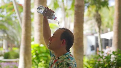 Pouring water on head on a hot day in slow motion 180fps