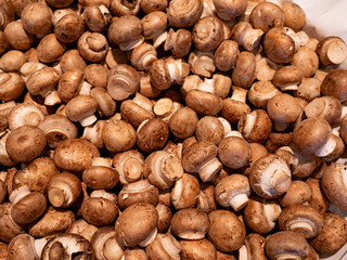 Bunch of white button mushrooms for sale in the market top view