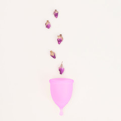 Pink menstrual cup, concept of women's health and eco-friendly lifestyle and women's health.Zero waste