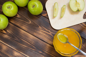 Summer harvest holiday background with copy space. Apples and honey. Top view.