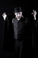 mime shows theatrical emotions on black background