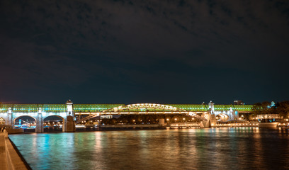 Embankment of the Moscow river. Green bridge and night lights of the city.