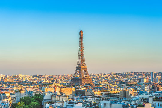 skyline of paris with eiffel tower at dusk