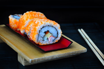 Sushi Roll on Red Tray with Chopsticks