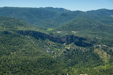 Fototapeta na wymiar View from a viewpoint of the Mountain Range of Cazorla with detail of a ridge in the middle of several mountains. Photography taken in the Mountain Range of Cazorla Jaen, Spain