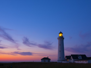 Fototapeta na wymiar Hirtshals lighthouse at sunset on the coast of Denmark