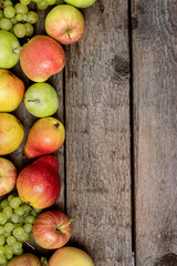 Autumn Still Life with Apples Pears and Green Grapes Wooden Background Harvesting Copy Space Autumn Background Vertical