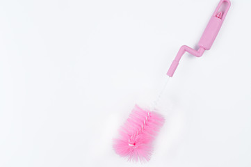 Pink brush for cleaning bottle isolated on white background.Copy space
