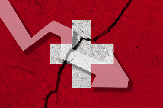 Switzerland Flag on the cracked wall with arrow falling down. Concept of decrease in the country.