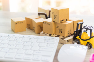 Mini forklift truck load cardboard boxes with text online shopping and symbol on wood pallet and...