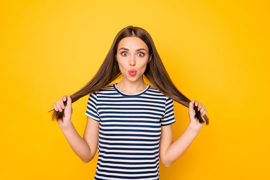 Closeup photo of amazing lady play with hair send air kiss wear striped outfit isolated yellow background
