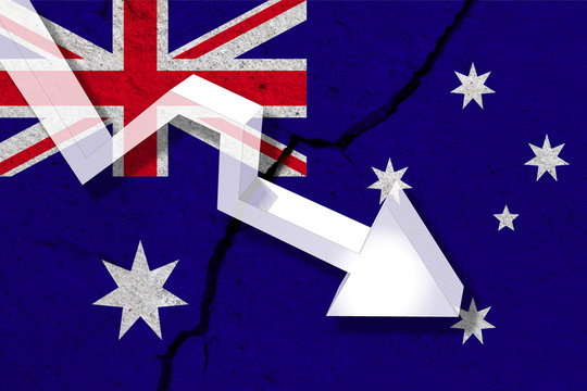Australia Flag on the cracked wall with arrow falling down. Concept of decrease in the country.