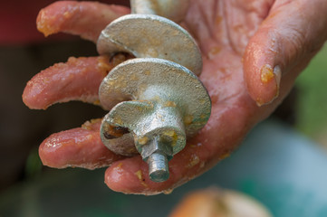 Machine for grinding fruit. Grinding of plums