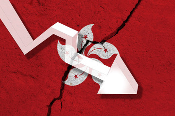 Hong Kong Flag on the cracked wall with arrow falling down. Concept of decrease in the country.