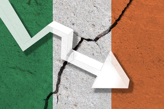 Ireland Flag on the cracked wall with arrow falling down. Concept of decrease in the country.