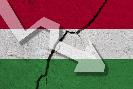 Hungary Flag on the cracked wall with arrow falling down. Concept of decrease in the country.