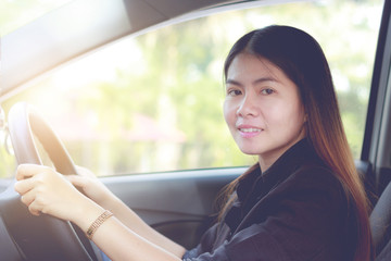 Fototapeta na wymiar Asia woman driving a car