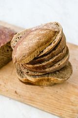 Ciabatta Sourdough Bread with Olive Oil on Wooden Board.
