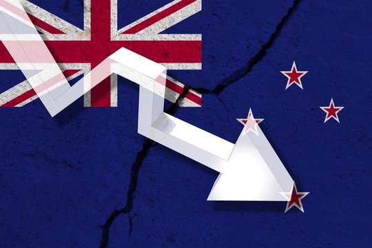 New Zeland Flag on the cracked wall with arrow falling down. Concept of decrease in the country.
