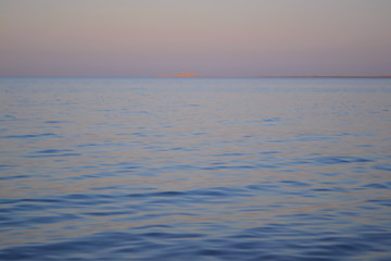 Obraz premium Sunset at sea. The shore of the Red Sea. Sand beach. Coast.