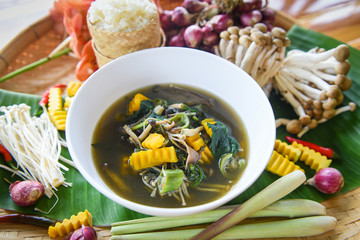 Mushroom soup herbs and spices ingredients Thai food served on bowl / Mix various kinds of mushrooms tradition northeast food Isaan delicious with vegetables pumpkin Thai menu Asian food