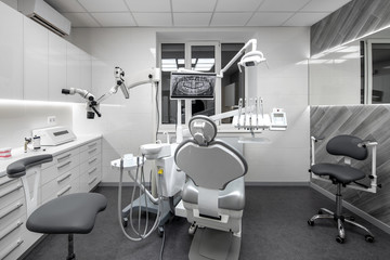 Contemporary dental clinic with light interior and hi-tech equipment - 284841148
