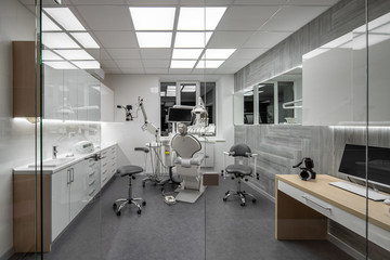 Contemporary dental clinic with light interior and hi-tech equipment - 284841311