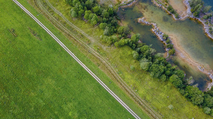 the road between forest and meadow