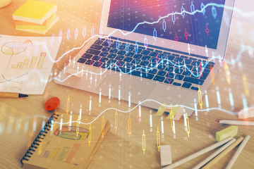 Forex market graph hologram and personal computer on background. Multi exposure. Concept of...
