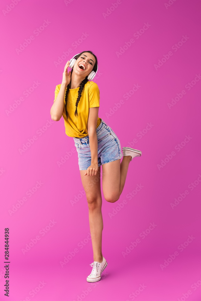 Sticker Full length of a cheerful young brunette girl