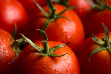 Red tomatoes background. Ripe red tomatoes. Lots of juicy red tomatoes.