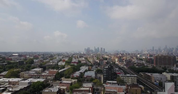 Drone over the Bronx with Manhattan skyline background