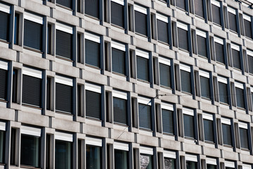 Row black window on concrete building