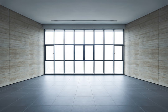 Empty space office interior with square pattern window,wall and tiles