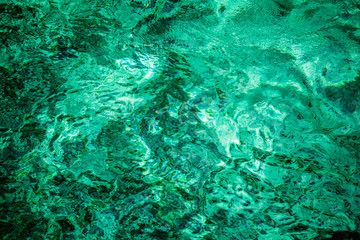 Blue emerald water rippled background