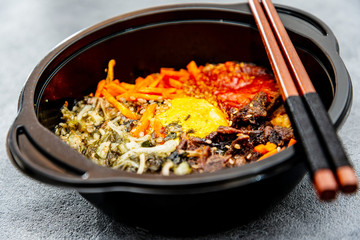 Bibimbap Rice, vegetables, minced marinated beef, spicy sauce and egg yolk