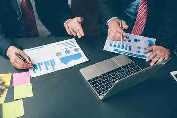 Business people are analyzing and planning business. Business Strategy Consulting