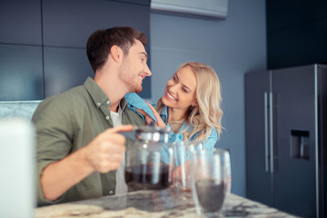 Couple smiling while enjoying morning at home together