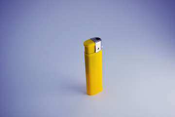 yellow cigarette lighter make by plastic and used gas